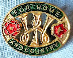 The WI badge with the words "For home and country"