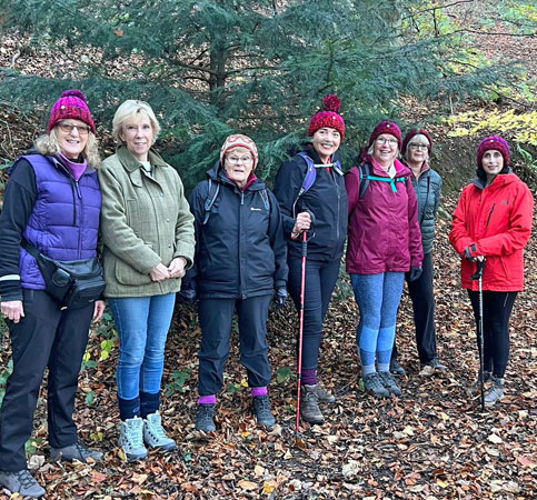 Seven members pose for the camera, ready for a country walk